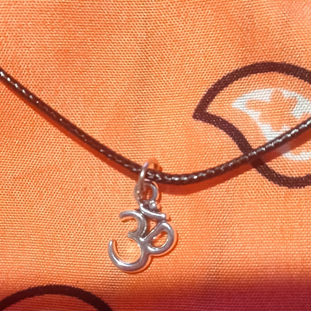 Black cord necklace with ohm charm